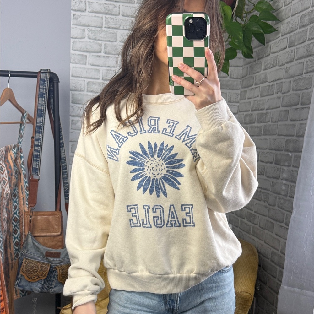 American Eagle Outfitters // Cream Sweatshirt with Blue Sunflower Graphic